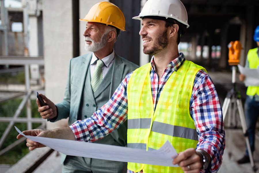 Specialized Business Insurance - Contractors Talking About a Construction Project